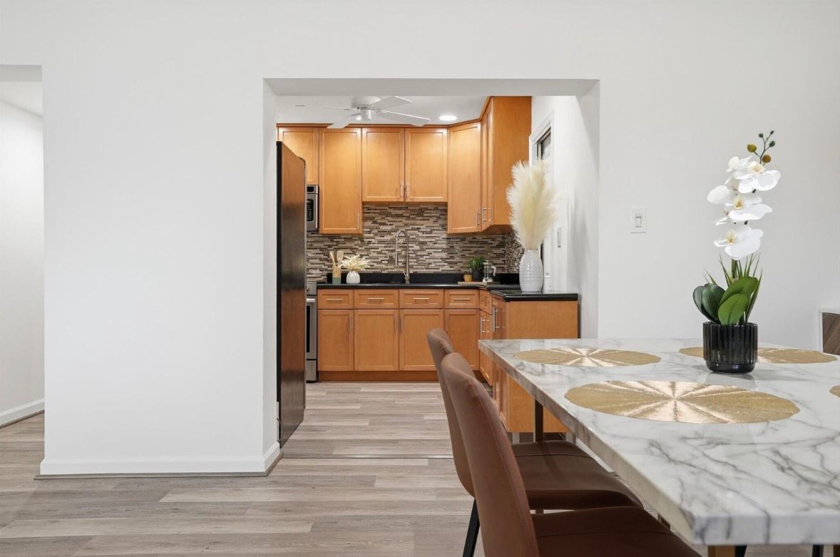 Finished dining area with open kitchen connection