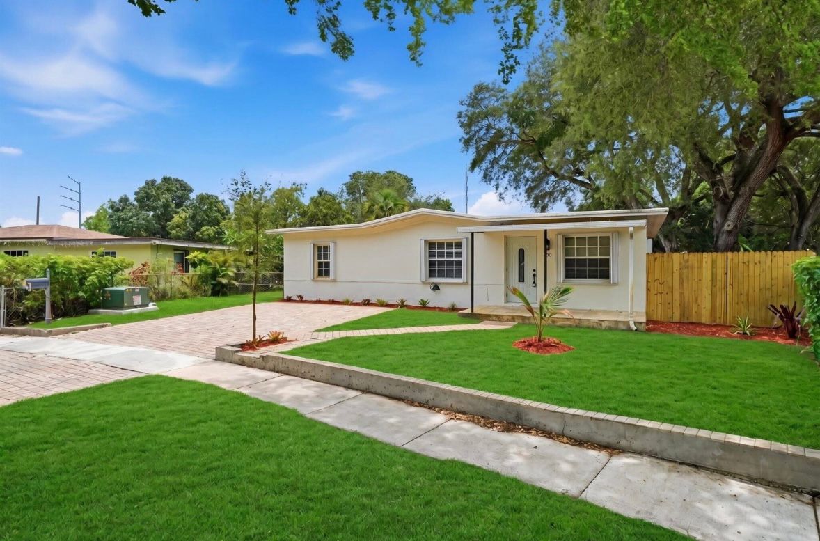 Completed residential exterior with landscaped grounds
