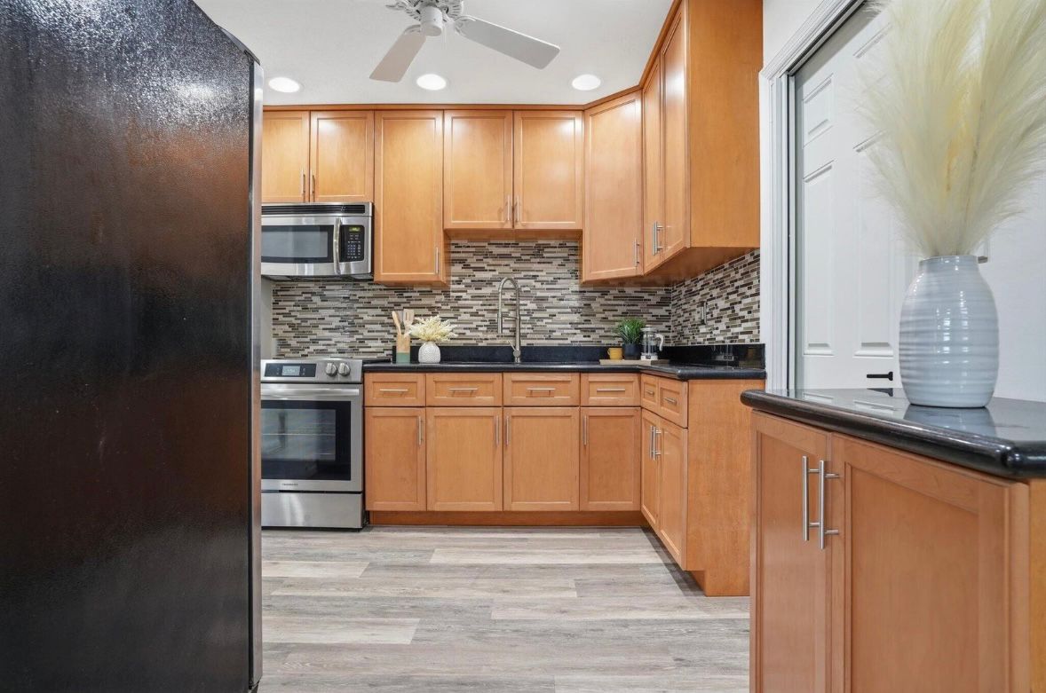 Finished kitchen with warm wood cabinetry