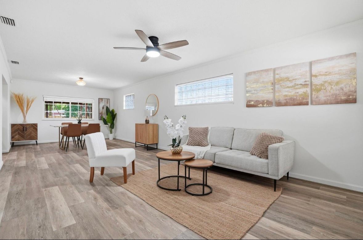 Bright finished living room with dining area