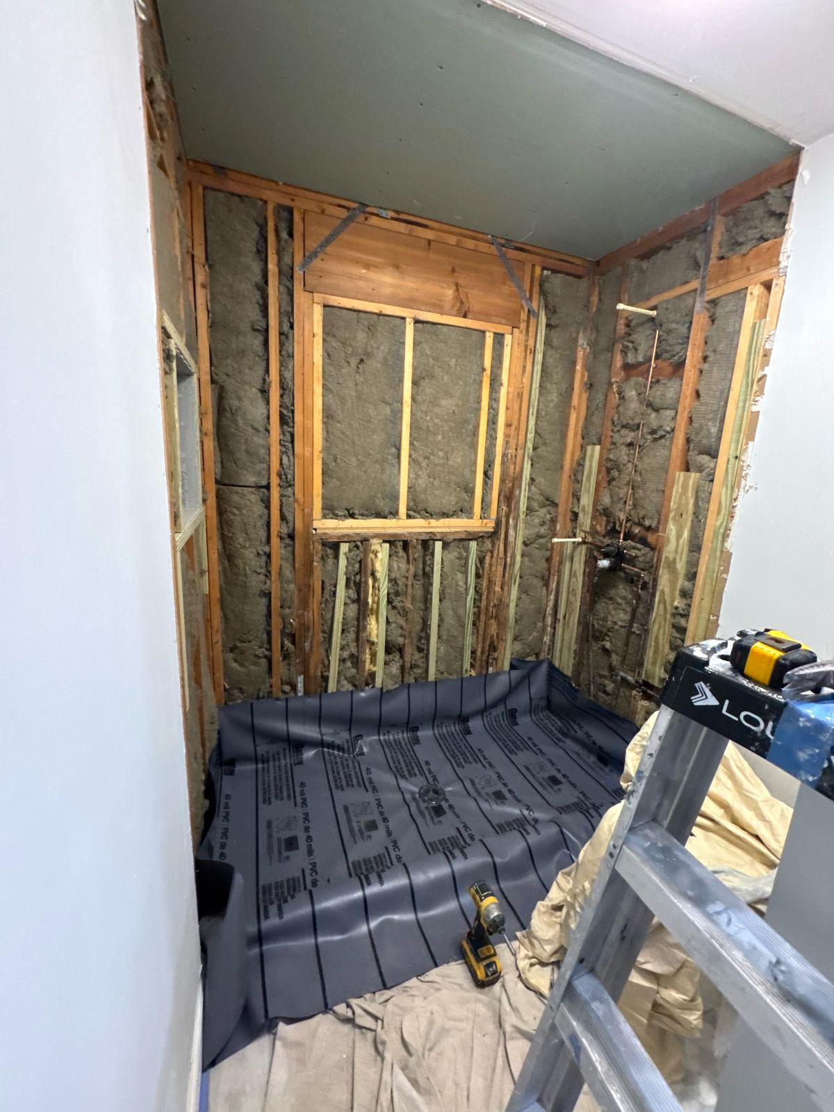 Bathroom framing and waterproofing preparation in progress