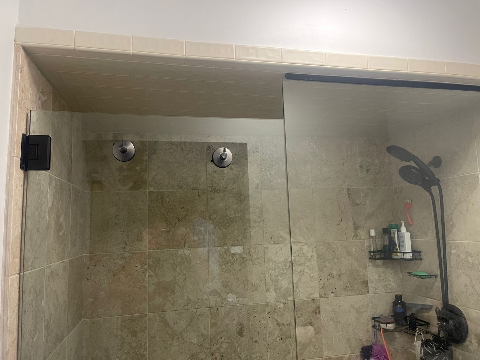 Completed shower fixtures and tile detail