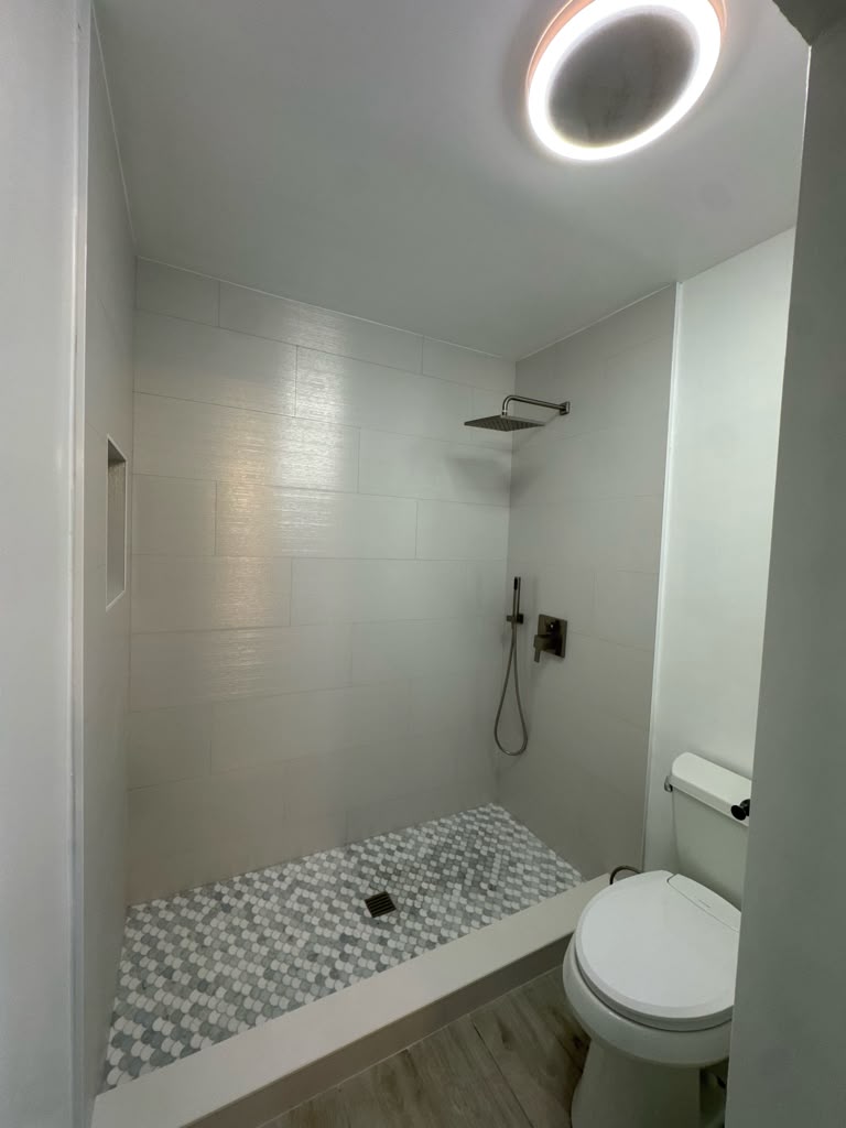 Completed bathroom shower and tile floor