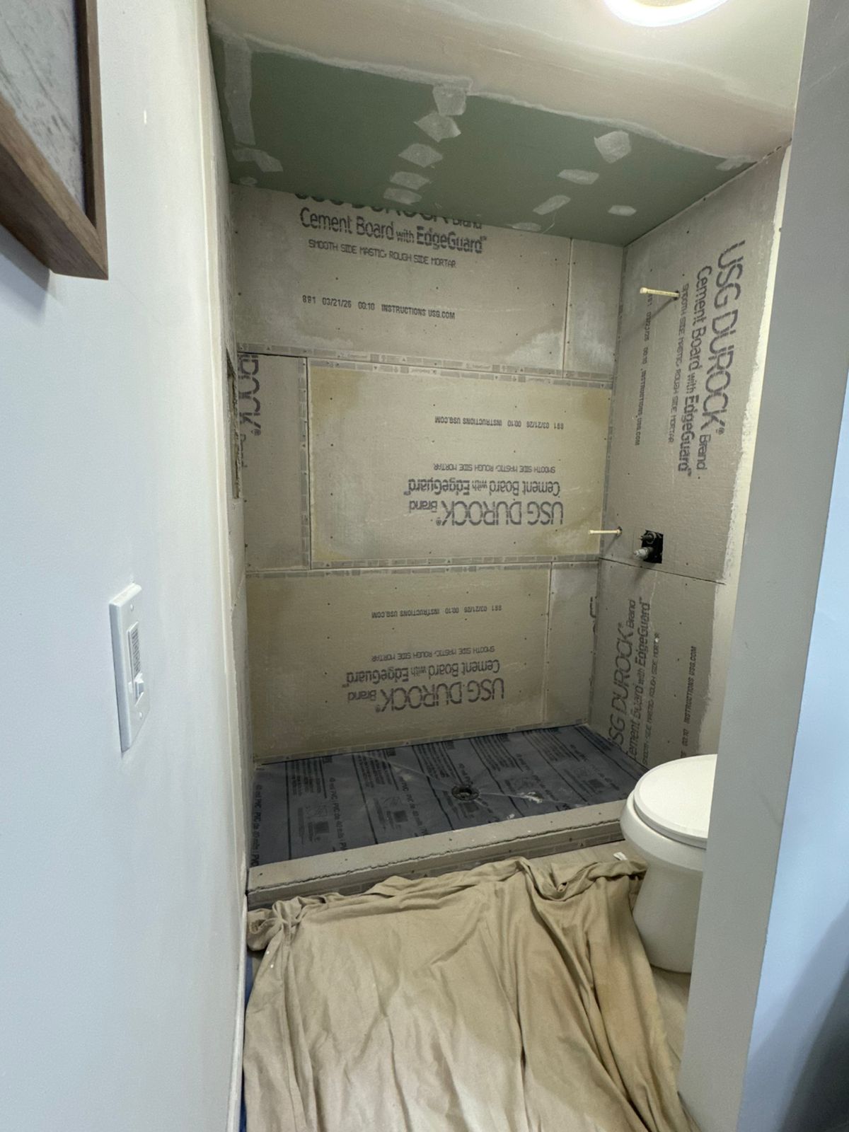 Bathroom cement board installation in progress