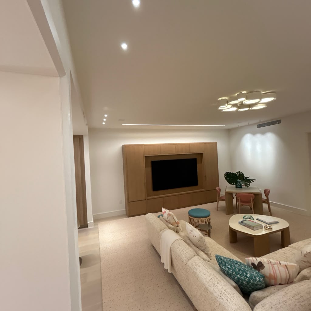 Finished luxury living space with custom media wall