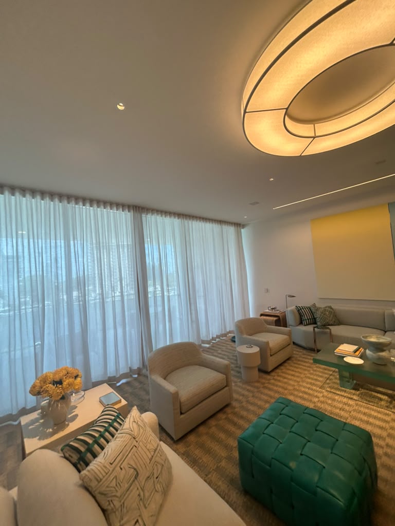 Finished lounge with custom lighting and built-in details