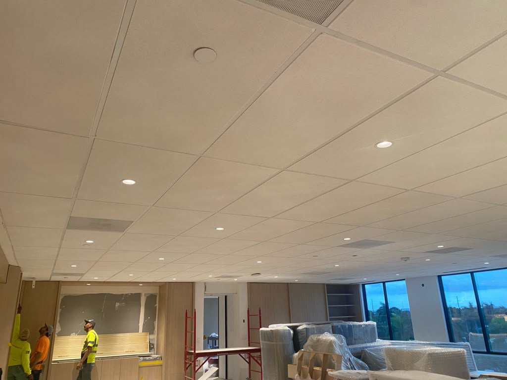 Commercial interior with finished acoustic ceiling and installation work
