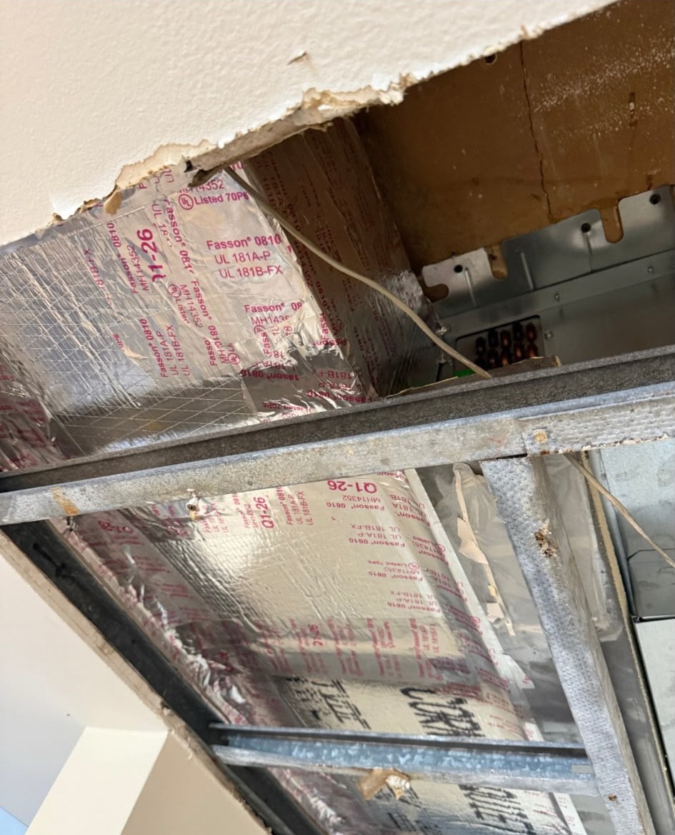 Air conditioning ductwork and insulation in progress